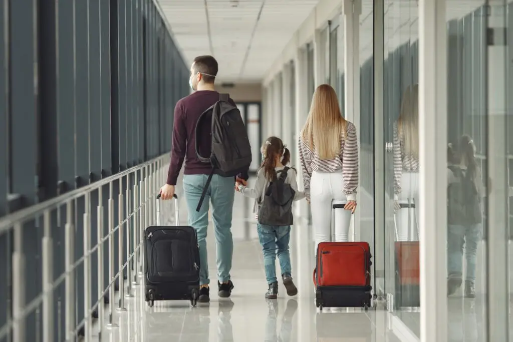 Couple with their young daughter at the airport for immigration and life transitions counseling